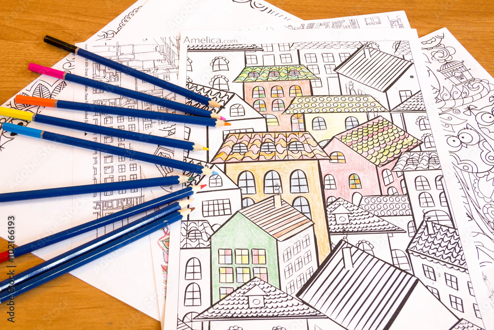 Obraz premium Adult colouring books with pencils, new stress relieving trend, mindfulness concept person coloring illustrative