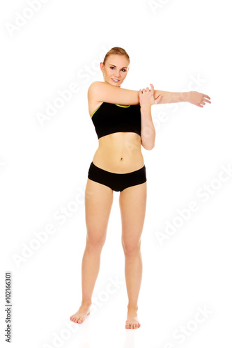 Young woman doing stretching exercise