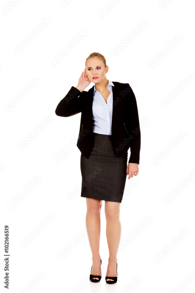 Young business woman overhears a conversation Young business woman overhears a conversation
