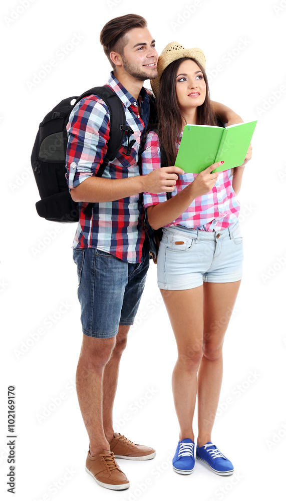 A pair of happy tourists sightseeing in summer, isolated on white A pair of happy tourists sightseeing in summer, isolated on white