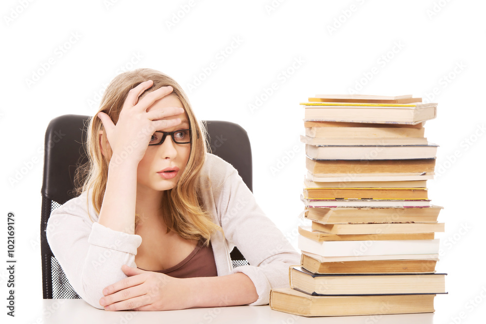 Young woman with a books pile Young woman with a books pile