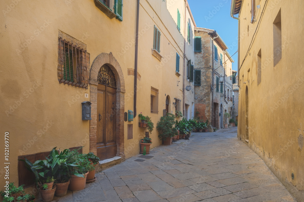 Beautiful and colorful streets of the small and historic Tuscan village Pienza, Italy 