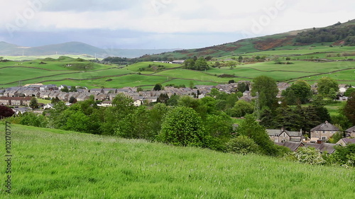 The north and east fringes of the town of Kendal in the English lake District, seen from Castle Hill, panning right from a northerly view to an easterly view over the suburbs towards Hay Fell. photo