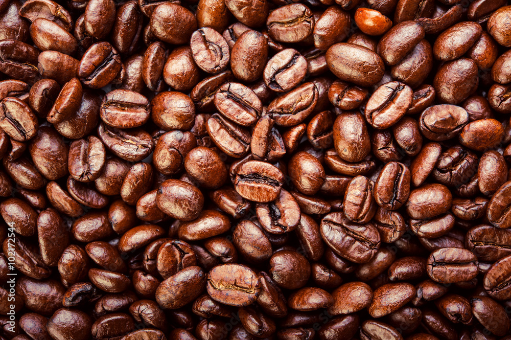 Roasted coffee beans. Background, macro. Top view