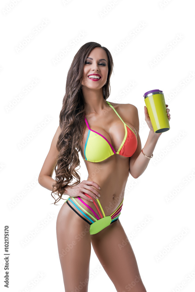 Fitness. Sexy female athlete posing with shaker Stock Photo | Adobe Stock