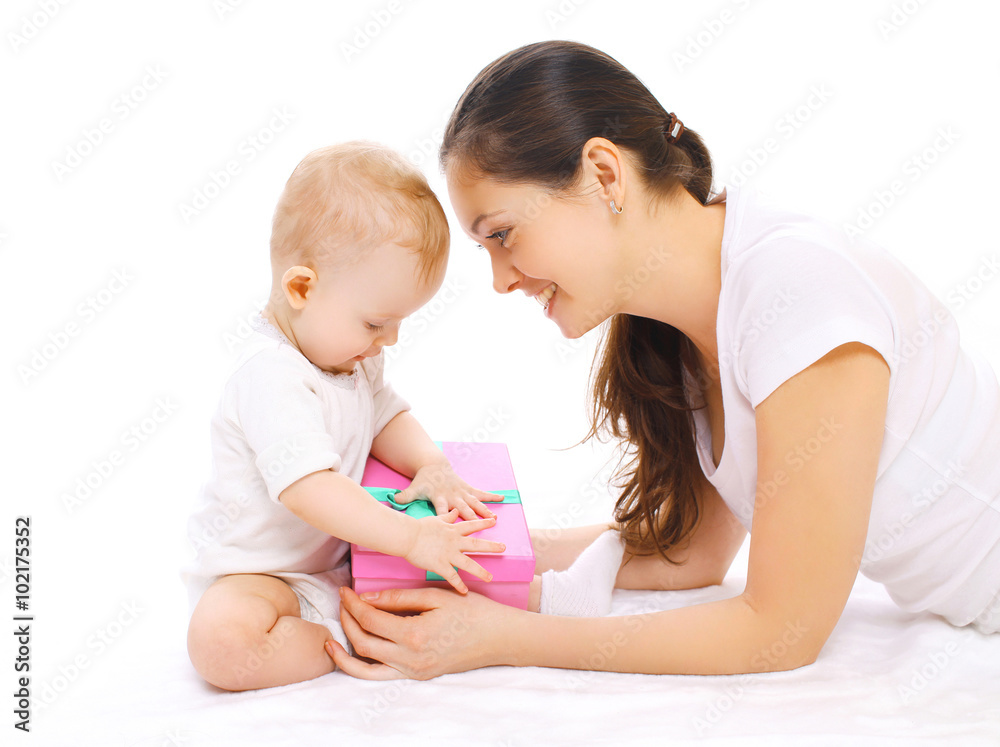 Happy smiling mother and baby with gift box on a white backgroun Happy smiling mother and baby with gift box on a white backgroun