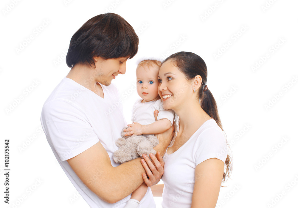 Happy young family together, mother and father with baby on a wh Happy young family together, mother and father with baby on a wh