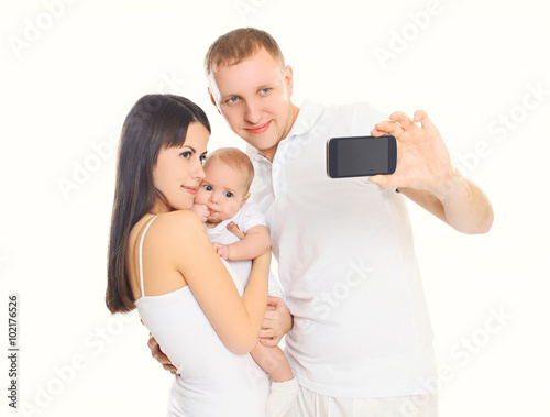 Happy family, mother and father with baby makes self-portrait on