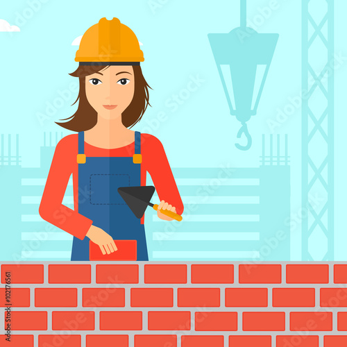 Bricklayer with spatula and brick.