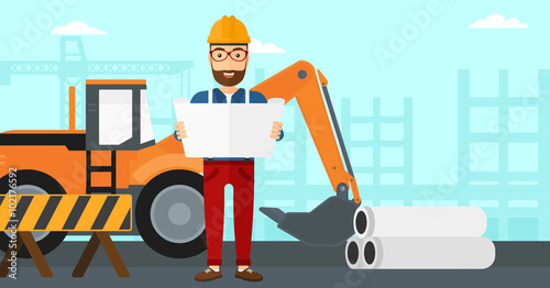 Engineer holding a blueprint.