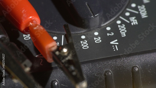 Macro view of an electric tester tool with voltage test enabled photo