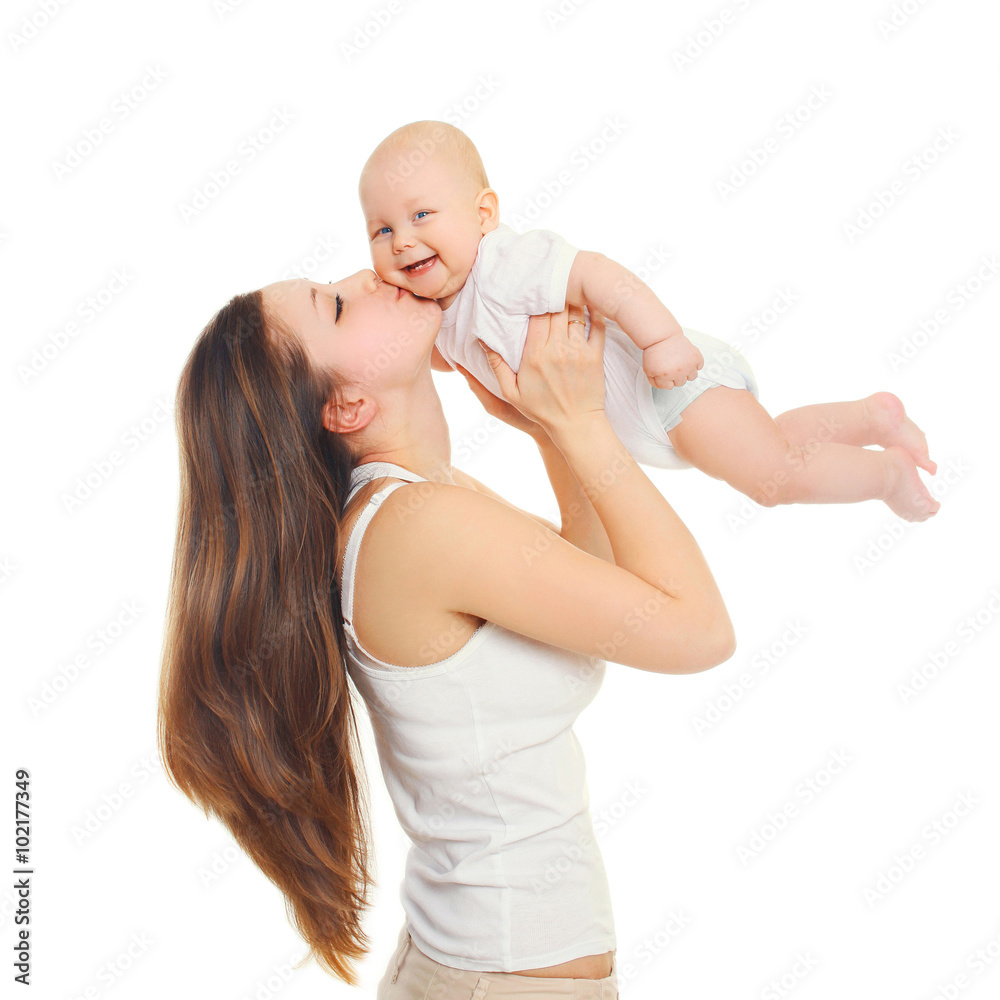 Happy mother playing kissing baby on white background Happy mother playing kissing baby on white background