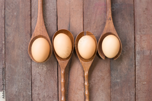 Eggs on a Wooden kitchenware.and wood background