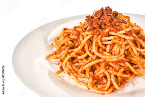 Italian pasta with tomato sauce on white background