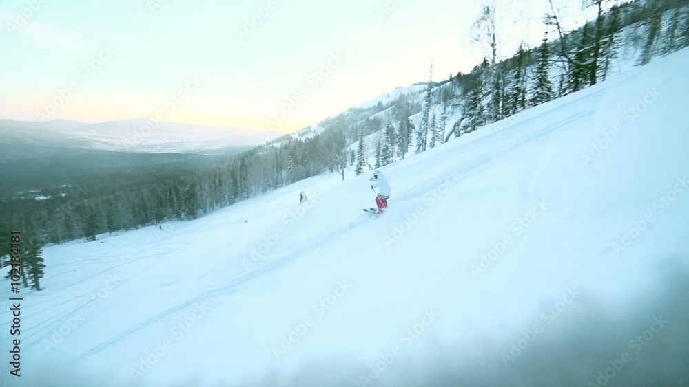 Skier sliding down a slope through snow powder surrounded by a picturesque mountain panorama Skier sliding down a slope through snow powder surrounded by a picturesque mountain panorama