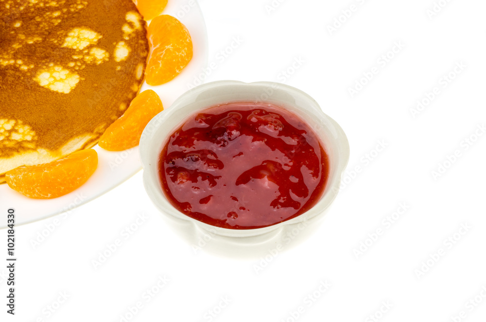 pancake and orange and strawberry sauce on white plate pancake and orange and strawberry sauce on white plate
