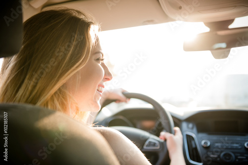 Fototapeta Evening drive - teenager at car