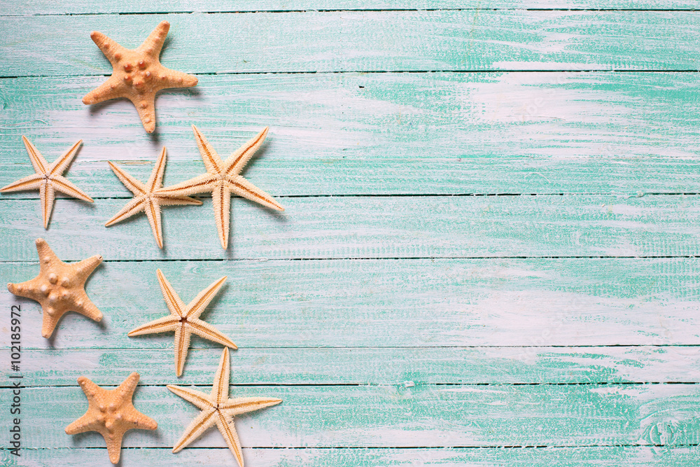 Marine items ( sea stars) on wooden background. Marine items ( sea stars) on wooden background.