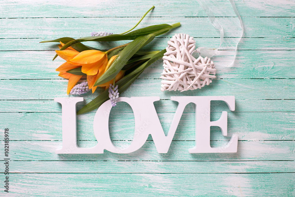 Yellow spring  tulips  flowers, word love and white decorative h - obrazy, fototapety, plakaty 