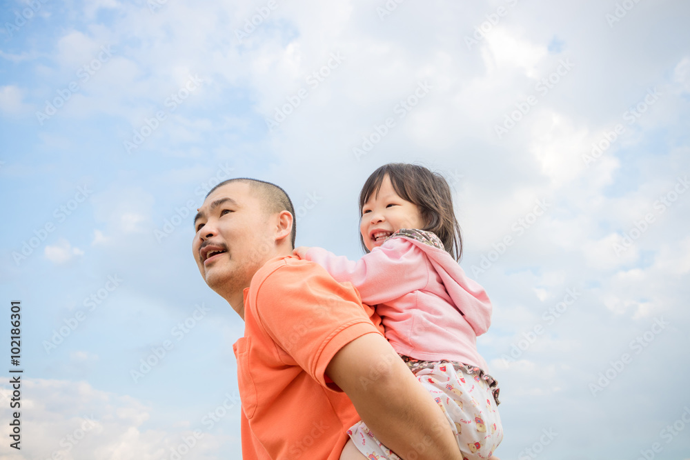 Asian father happy with his daughter outdoor Asian father happy with his daughter outdoor