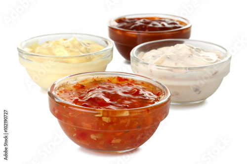Assorted sauces in a bowl isolated on white background