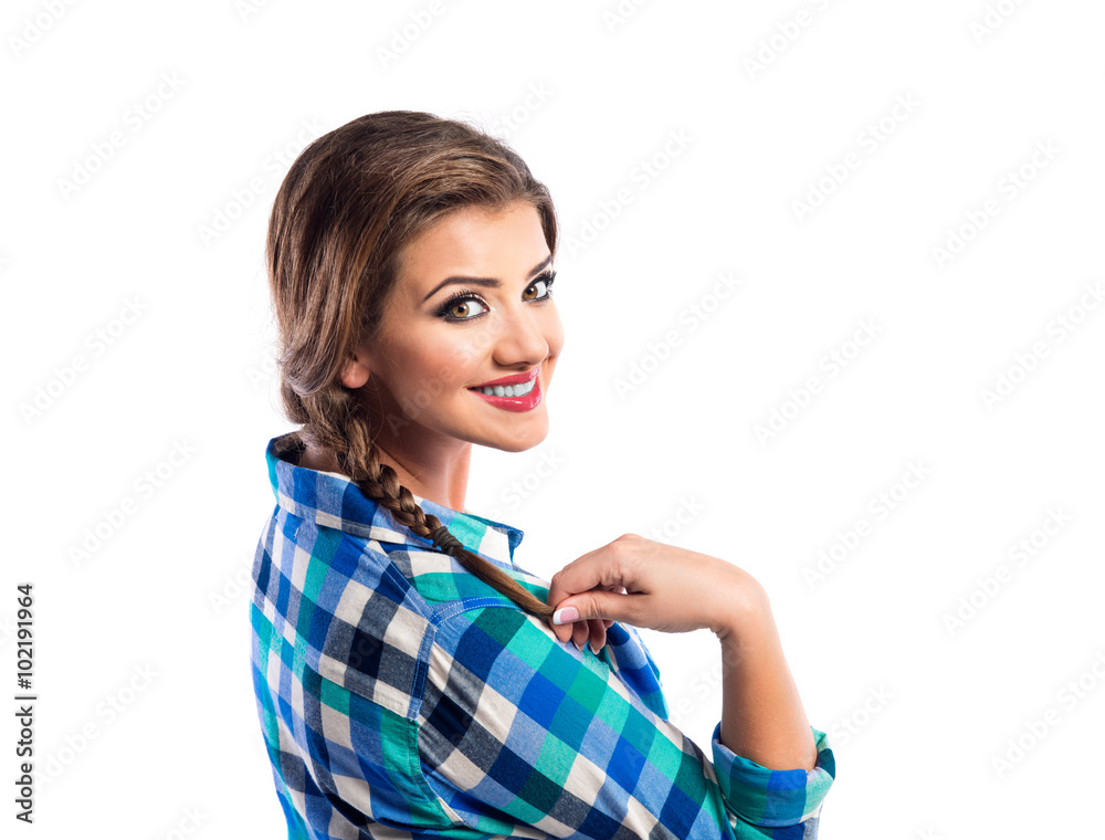 Woman with plait in blue and green checked shirt smiling Woman with plait in blue and green checked shirt smiling