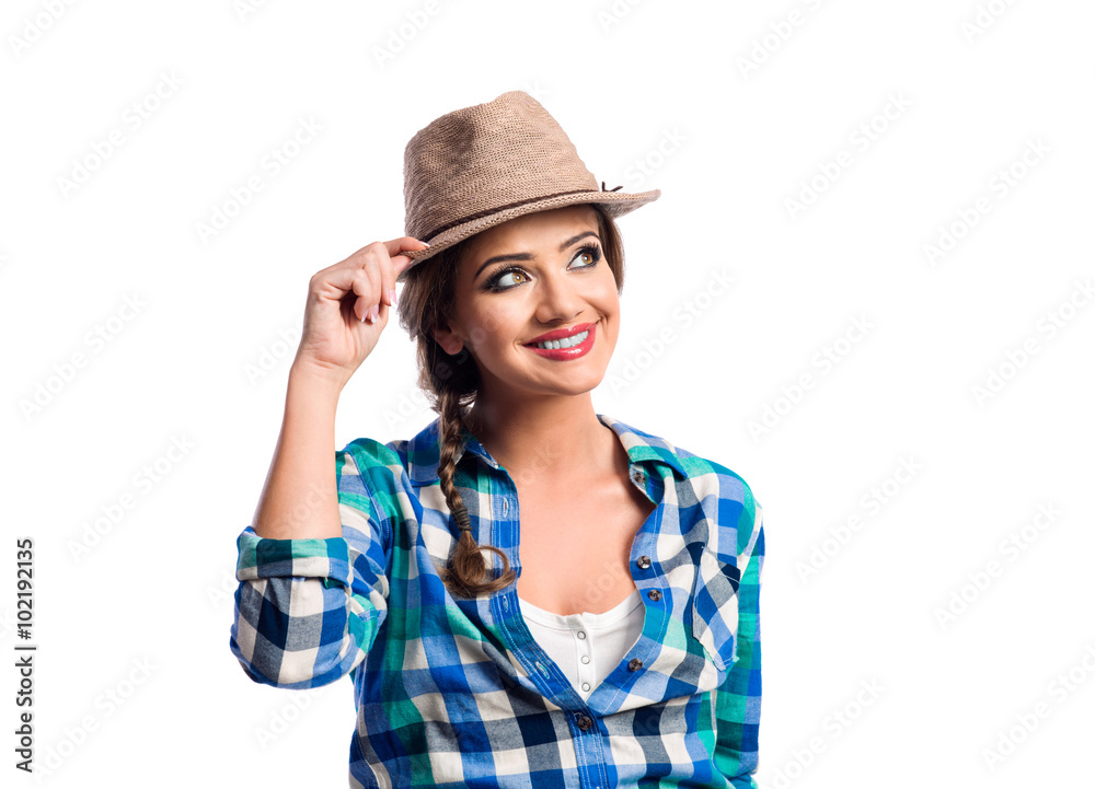 Woman with plait in blue and green checked shirt smiling Woman with plait in blue and green checked shirt smiling