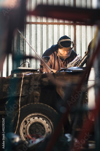 Mechanic repair and service car in garage © golubovy