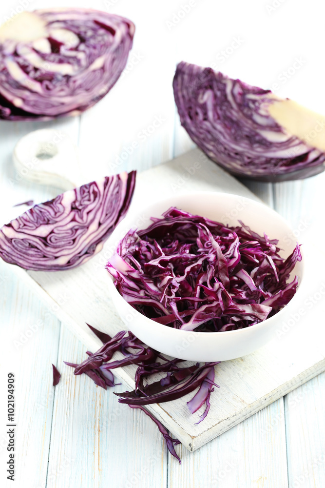 Fototapeta premium Ripe red cabbage on a blue wooden table