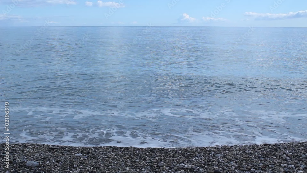 Calm Sea Central View. Waves Crashing onto the Shore. Calm Sea Central View. Waves Crashing onto the Shore.