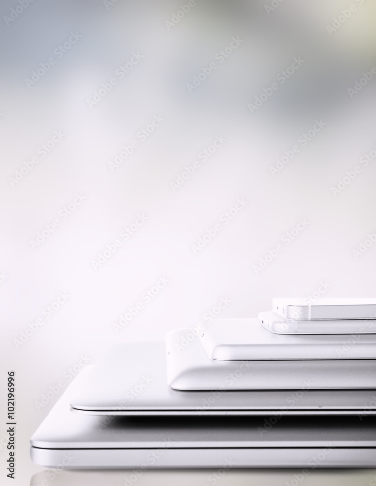 Pile of different modern electronics gadgets on abstract background Pile of different modern electronics gadgets on abstract background