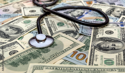 Stethoscope on the dollars. Concept.