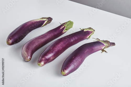fresh japanese long eggplants isolated on table