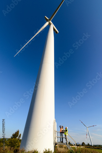 Engineers of Wind Turbine / Engineers at the base of the wind turbine control the operation and production.