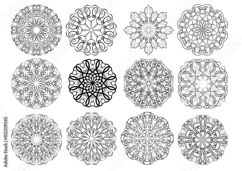 Set of elegant calligraphic circular lace design elements in black and white. Geometric regular ornament composed from swirly curves