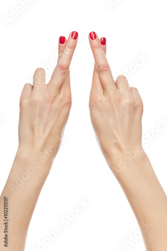 Female hand fingers crossed