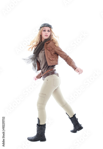 young blonde woman in a steampunk outfit, action hero pose. isolated on white background.