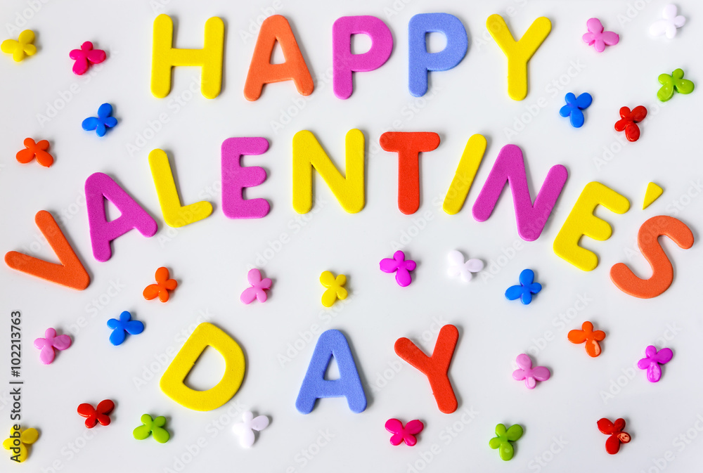 Fototapeta premium Text of colorful letters Happy Valentines day with multicolored small butterflies