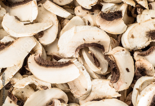 Photo of mushrooms champignon sliced for background or texture