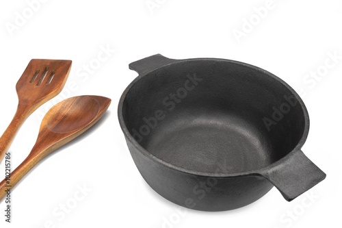 Empty Cast Iron Pot, Wooden Spatula And  Serving Spoon Isolated