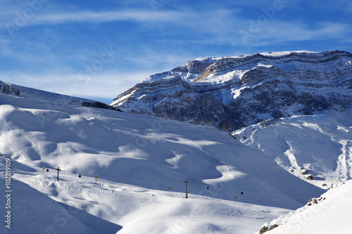 Ski resort and sunlight rocks at evening photo