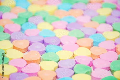 Selective focus of a candy heart background