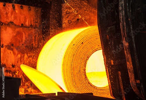 Roll of hot metal on the conveyor belt