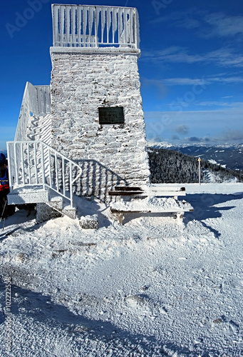 stony lookout (observatory point) on Pretulalpe hill in winter Fischbacher Alpen mountains covered by ice photo