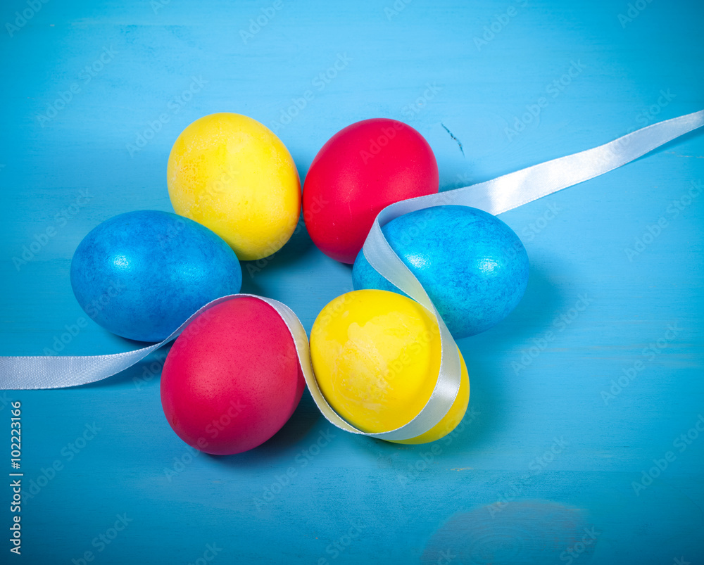 Easter eggs on blue background. Toned