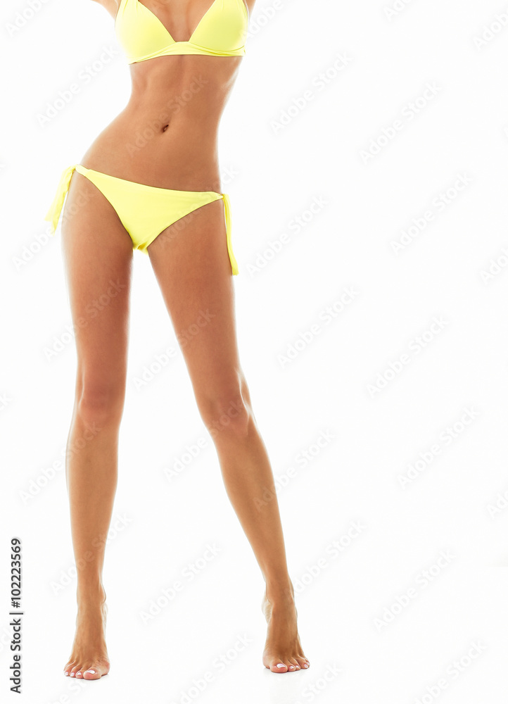 Sexy young woman posing in a bikini.Beautiful perfect figure. St