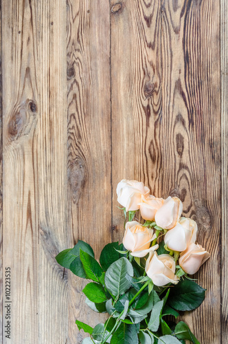 Roses on rustic table