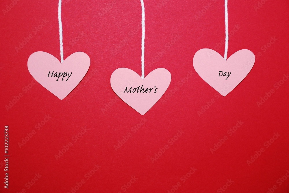 Hearts hanging from string on a red background with the text Happy Mother's Day