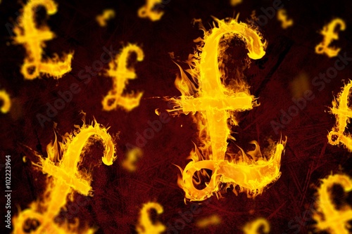 Composite image of british pound on fire 