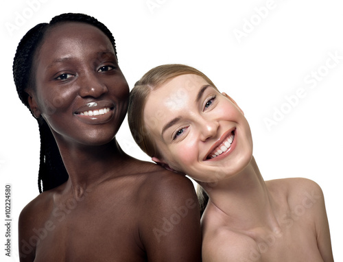 Portrait of two cheerful multiethnic women. Beautiful women, fla